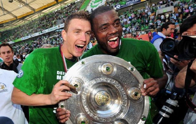 WOLFSBURG, GERMANY - MAY 23: Edin Dzeko and Grafite of Wolfsburg celebrate the German championship with the trophy after their Bundesliga match against SV Werder Bremen on May 23, 2009 in Wolfsburg, Germany. Wolfsburg won its first German championship ever. (Photo by Stuart Franklin/Bongarts/Getty Images)