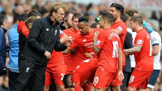 Liverpool manager Juergen Klopp talks to players during the English Premier League soccer match between Tottenham Hotspur and Liverpool at the White Hart Lane, London, England, Saturday, Oct. 17, 2015. (AP Photo/Rui Vieira)